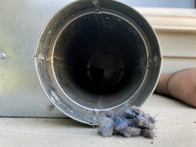 Stanton Dryer Vent Cleaning technician using specialized equipment to clear severe dryer vent blockage in Stanton